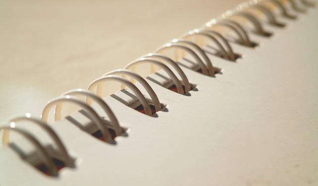 close-up of quilt binding being sewn with clips along the edge
