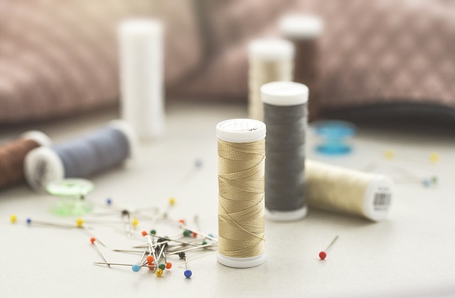 sewing workshop with fabric bolts and quilting tools on a table