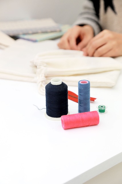 quilt sandwich being quilted with straight-line stitching on a sewing machine